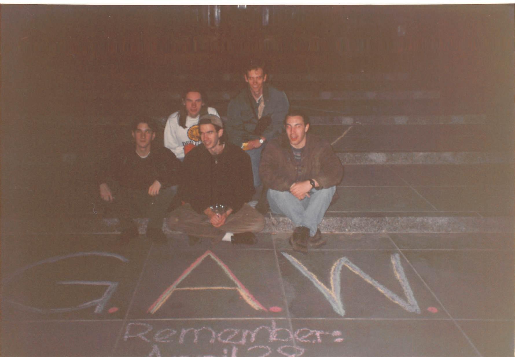 The five founders of Goiter Awareness Week pose with their chalk work in front of Yale's Sterling Memorial Library, April 28, 1996